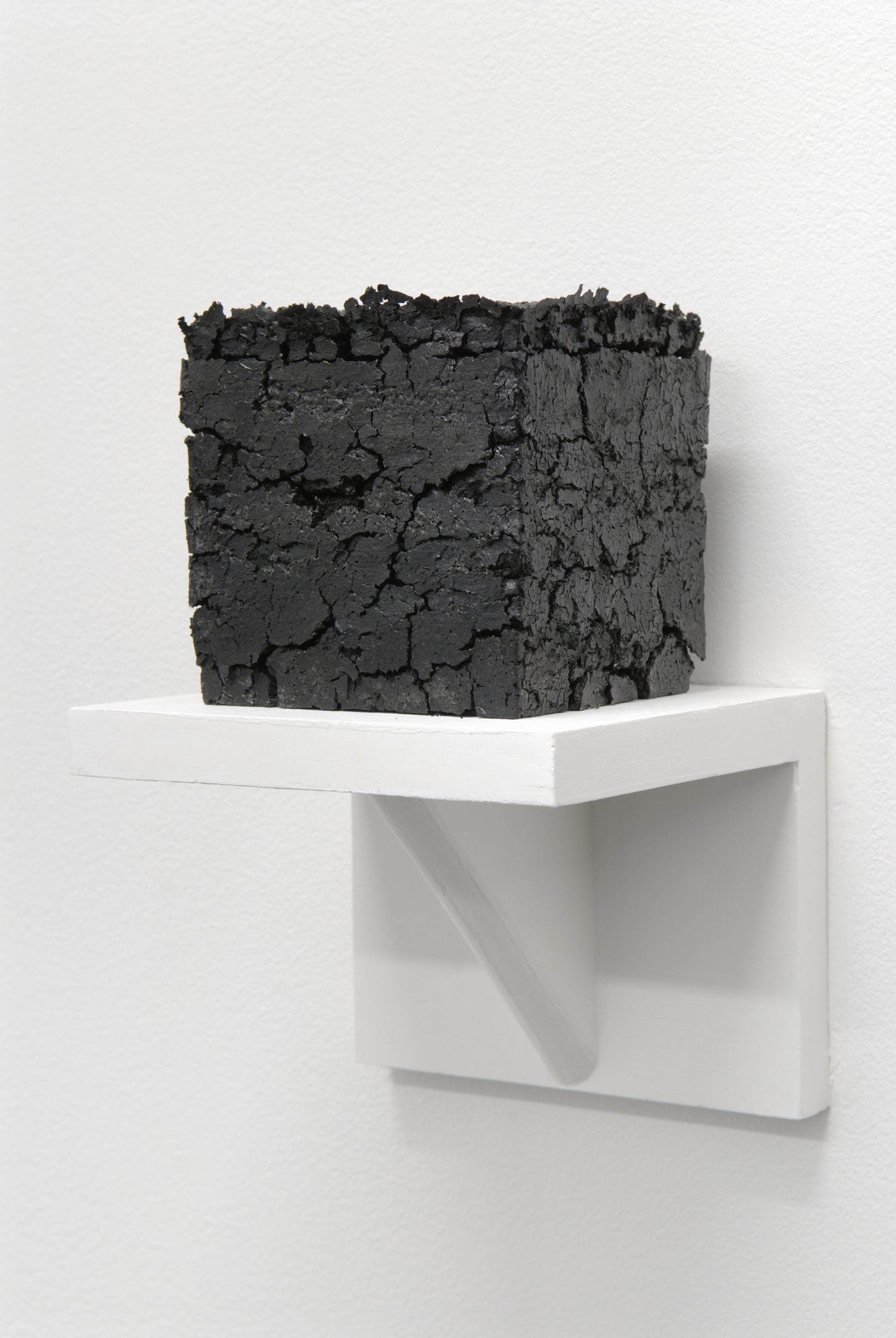 Vincent Como, 4.5 Cubic Inches (Volume of the Inside of My Head), 2007, cast sumi ink, 4.5” x 4.5” x 4.5” 